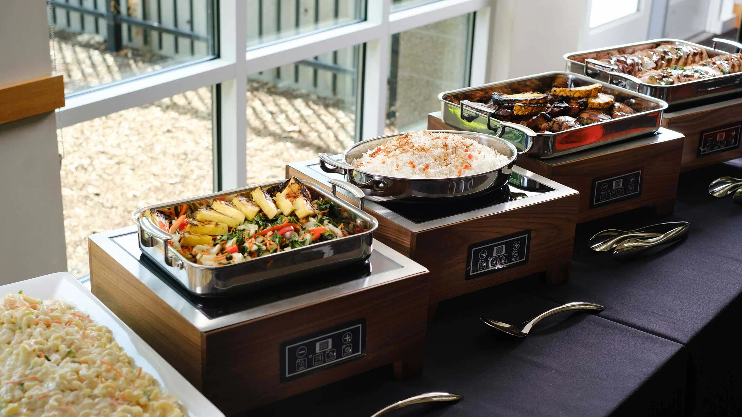 A catered buffet table with various dishes